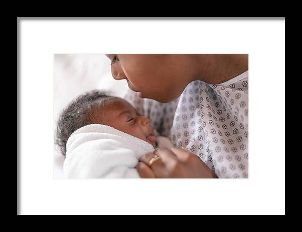 People Framed Print featuring the photograph A newborn and mother in a hospital by FatCamera