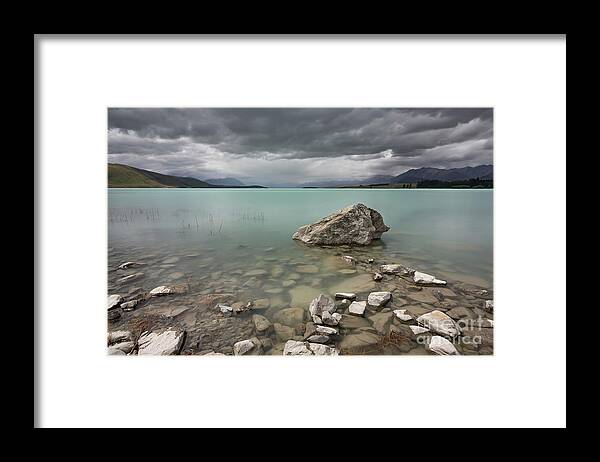 Beautiful Framed Print featuring the photograph A very gloomy afternoon at Lake Tekapo by Anges Van der Logt