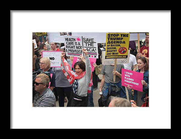 People Framed Print featuring the photograph Activists Protests Outside Of Trump Tower In Chicago by Scott Olson
