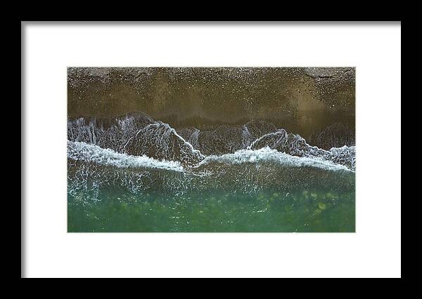 Waves Framed Print featuring the photograph Aerial view ocean waves braking on a sandy beach. Nature background by Michalakis Ppalis