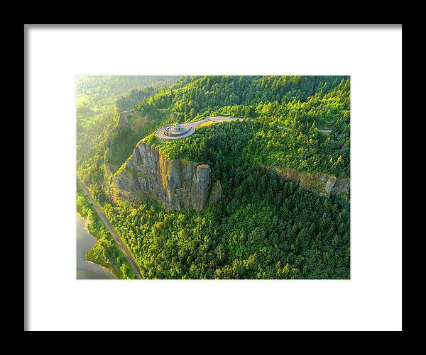 Golden Hour Framed Print featuring the photograph Golden hour aerial view of Vista House in Columbia River Gorge with sun revealing mossy cliffs by Chris Anson