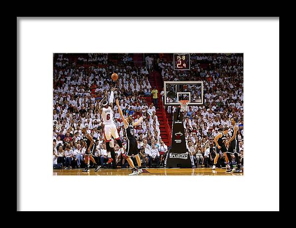 Lebron James Framed Print featuring the photograph Andrei Kirilenko and Lebron James by Mike Ehrmann