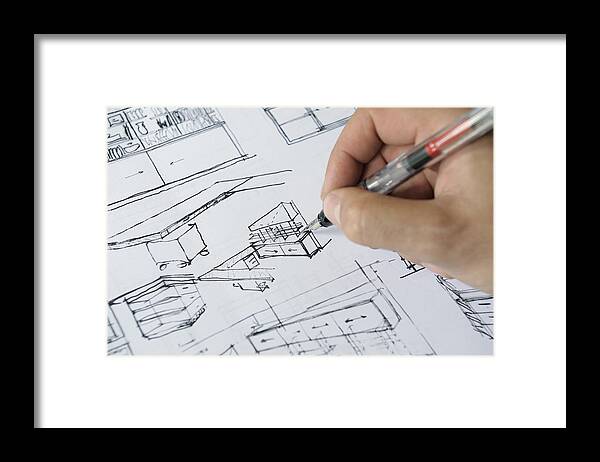 One Man Only Framed Print featuring the photograph Architects hand sketching interior plans by David Malan