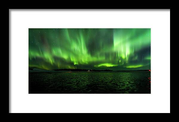 Aurora Framed Print featuring the photograph Emerald Veil Over Frozen Terrain by Kyle Lavey