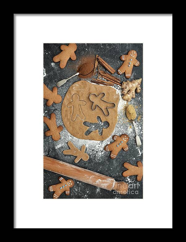 Gingerbread Men Framed Print featuring the photograph Baking Gingerbread Men Biscuits by Tim Gainey