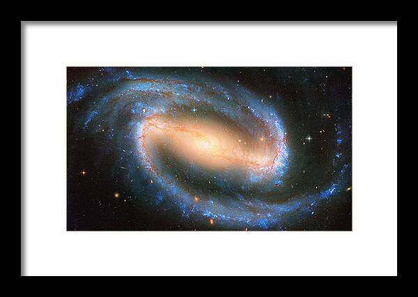 Barred Spiral Galaxy Framed Print featuring the photograph Barred Spiral Galaxy by Mango Art