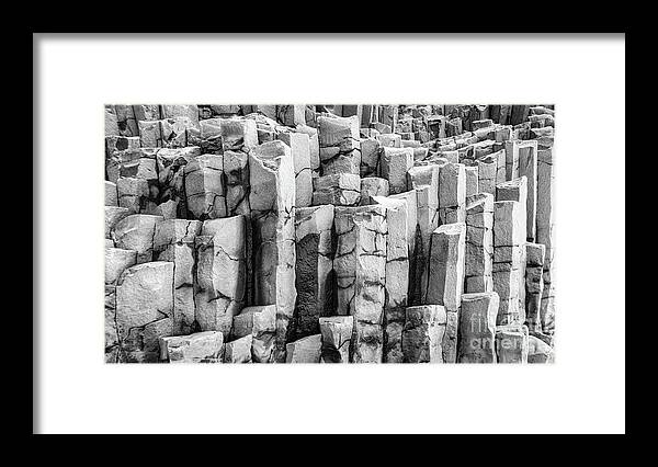Basalt Framed Print featuring the photograph Basalt columns in black and white by Lyl Dil Creations