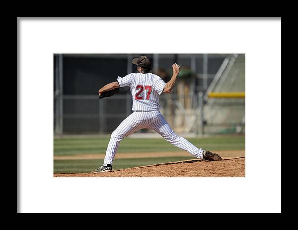Sports Ball Framed Print featuring the photograph Baseball pitcher throwing the ball by Matt_Brown
