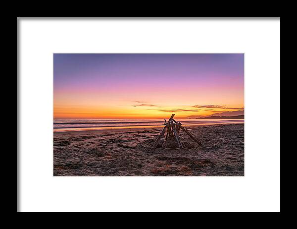 Sunset Framed Print featuring the photograph Beach Sunset Over Driftwood Sculpture by Lindsay Thomson