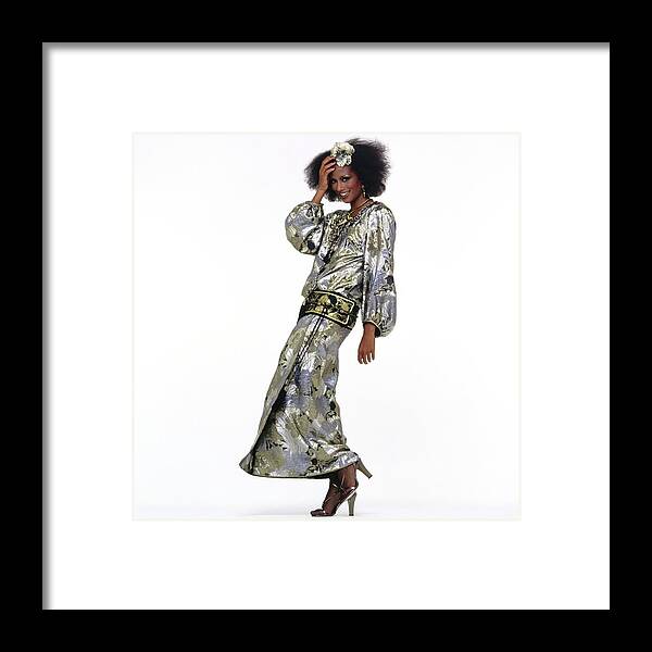 Fashion Framed Print featuring the photograph Beverly Johnson Wearing A Silver Saint Laurent Dress by Albert Watson