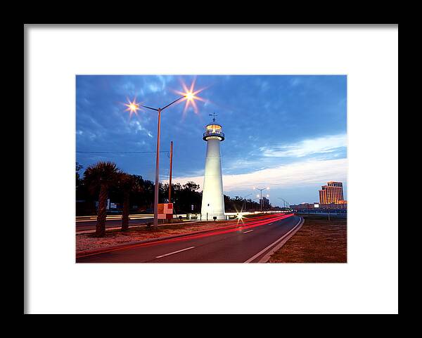 Water's Edge Framed Print featuring the photograph Biloxi Lighthouse by DenisTangneyJr