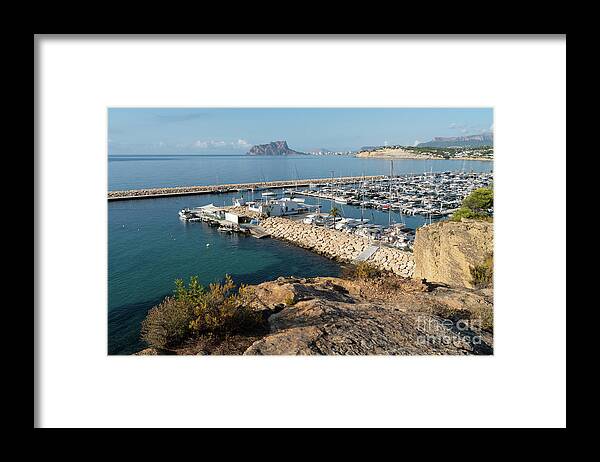 Mediterranean Coast Framed Print featuring the photograph Blue Mediterranean Sea and marina in Moraira 1 by Adriana Mueller