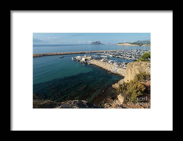 Mediterranean Coast Framed Print featuring the photograph Blue Mediterranean Sea and marina in Moraira 2 by Adriana Mueller