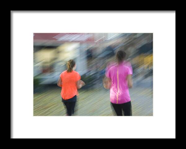 North Holland Framed Print featuring the photograph Blurred image of two female joggers by Lyn Holly Coorg
