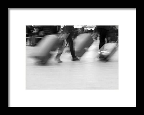 Crowd Of People Framed Print featuring the photograph Blurred movement of Travellers with luggage by Lyn Holly Coorg