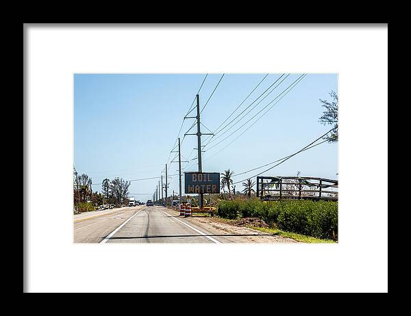 Tropical Tree Framed Print featuring the photograph Boil Water alert sign in Florida Keys after hurricane by Jodi Jacobson