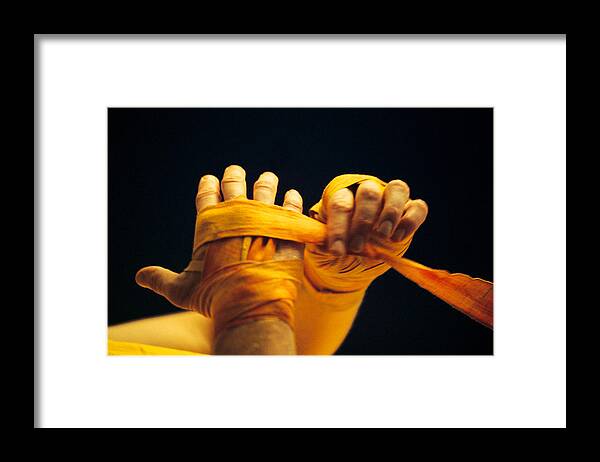 People Framed Print featuring the photograph Boxer wrapping hands by Comstock
