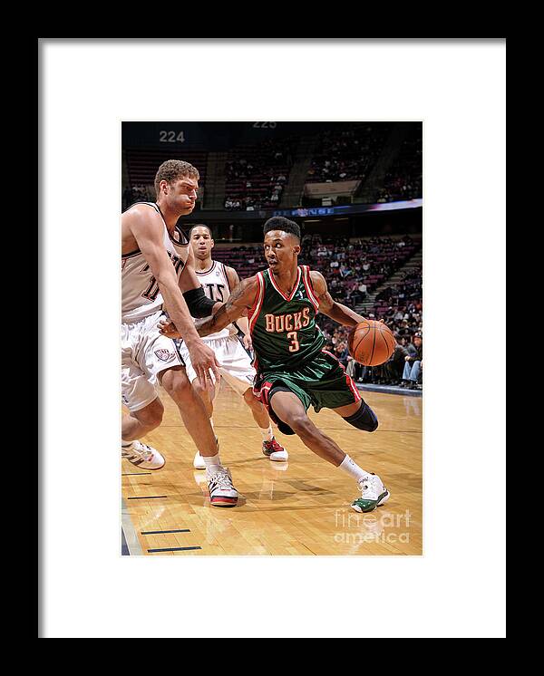 Nba Pro Basketball Framed Print featuring the photograph Brook Lopez and Brandon Jennings by David Dow