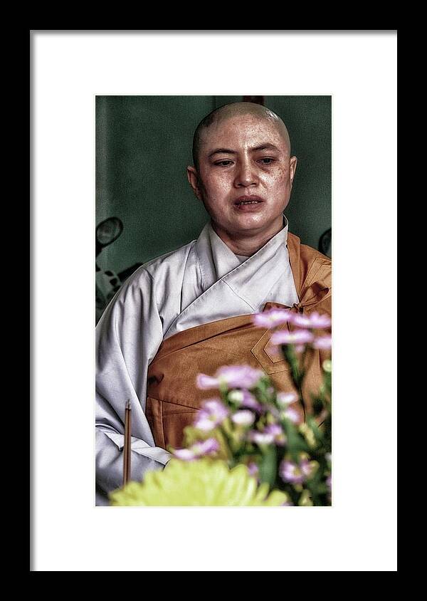 Buddhism Framed Print featuring the photograph Buddhist nun by Robert Bociaga