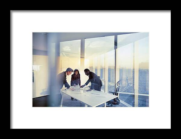 Expertise Framed Print featuring the photograph Business colleagues planning together in meeting by Shannon Fagan