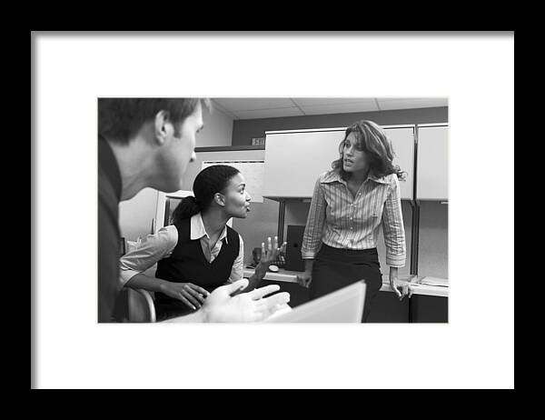 Mid Adult Women Framed Print featuring the photograph Businesspeople talking in office by Comstock Images