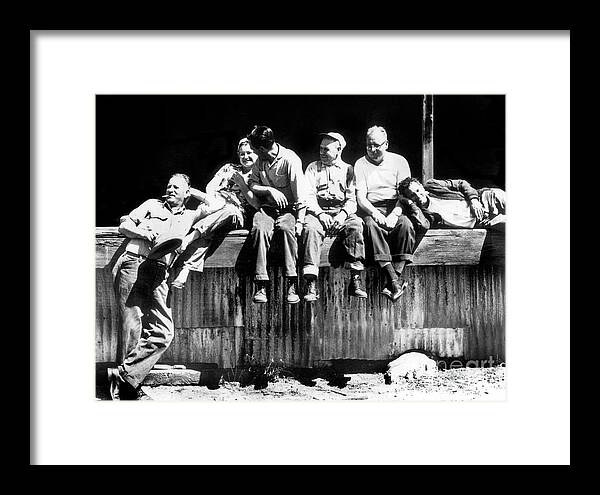 Cannery Framed Print featuring the photograph Canney workers take a brake on the loading dock of Hovden Cannery 1950 by Monterey County Historical Society