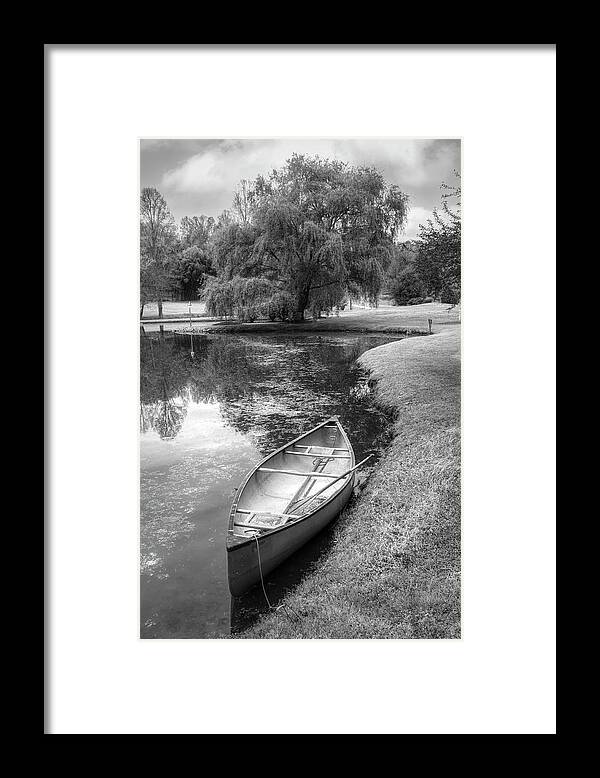 Boats Framed Print featuring the photograph Canoe in Spring in Black and White by Debra and Dave Vanderlaan