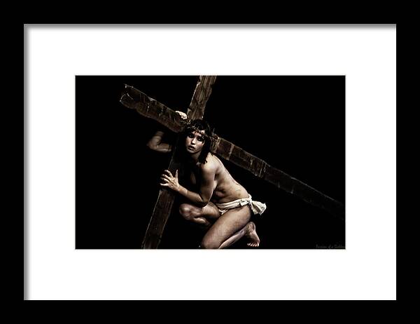 Carrying Framed Print featuring the photograph Carrying the cross II by Ramon Martinez