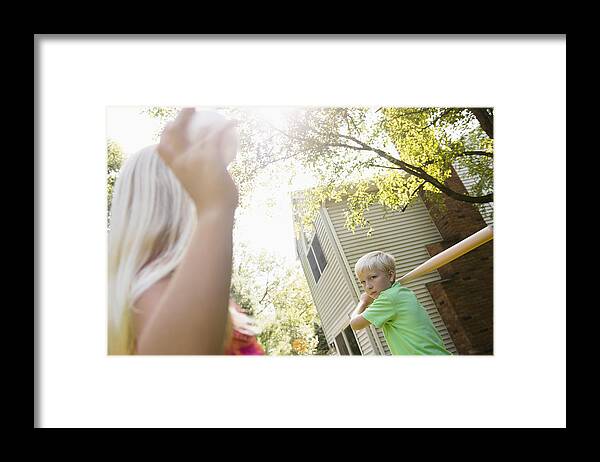 Child Framed Print featuring the photograph Caucasian children playing baseball in backyard by JGI/Jamie Grill