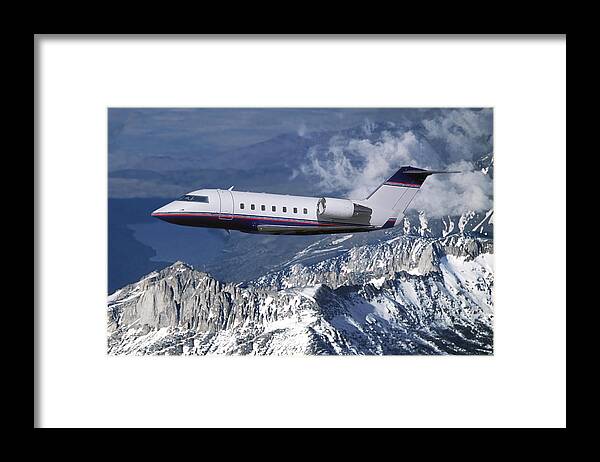Challenger Business Jet Framed Print featuring the mixed media Challenger Corporate Jet over Snowcapped Mountains by Erik Simonsen