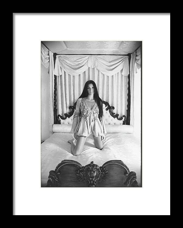 Actress Framed Print featuring the photograph Cher On A Canopy Bed by Berry Berenson