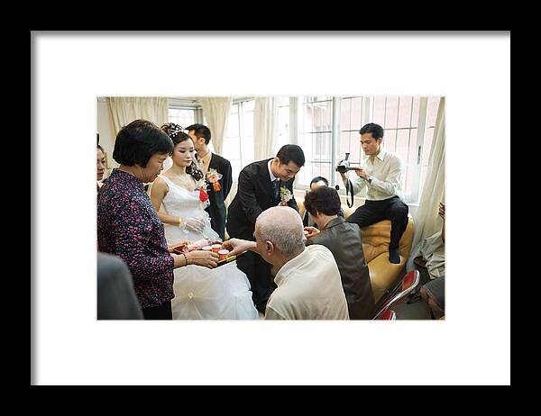 Young Men Framed Print featuring the photograph Chinese wedding tea ceremony by PhotoAlto/James Hardy