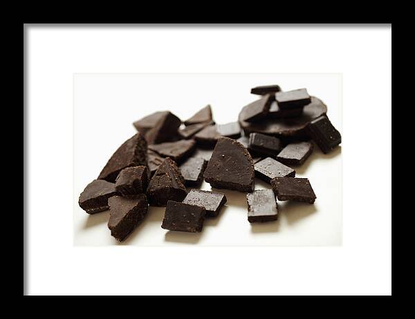 White Background Framed Print featuring the photograph Chocolate pieces, close-up by Jack Hollingsworth