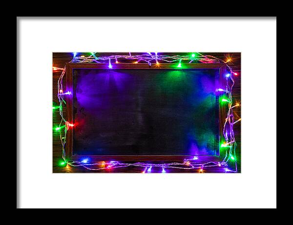 Event Framed Print featuring the photograph Christmas background with Christmas decorations and garland. by Anton Petrus