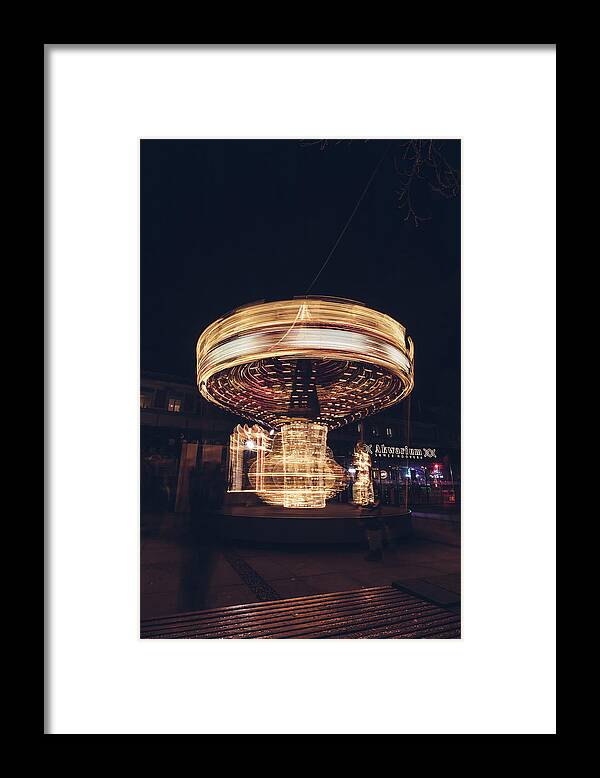 Illuminations Framed Print featuring the photograph Christmas carousel on the streets of Warsaw. Fire Wheel by Vaclav Sonnek