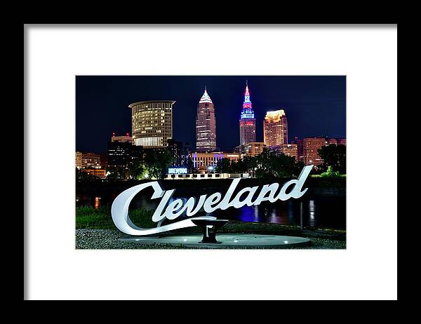 Cleveland Framed Print featuring the photograph CLE with Sign Along the Cuyahoga River by Frozen in Time Fine Art Photography