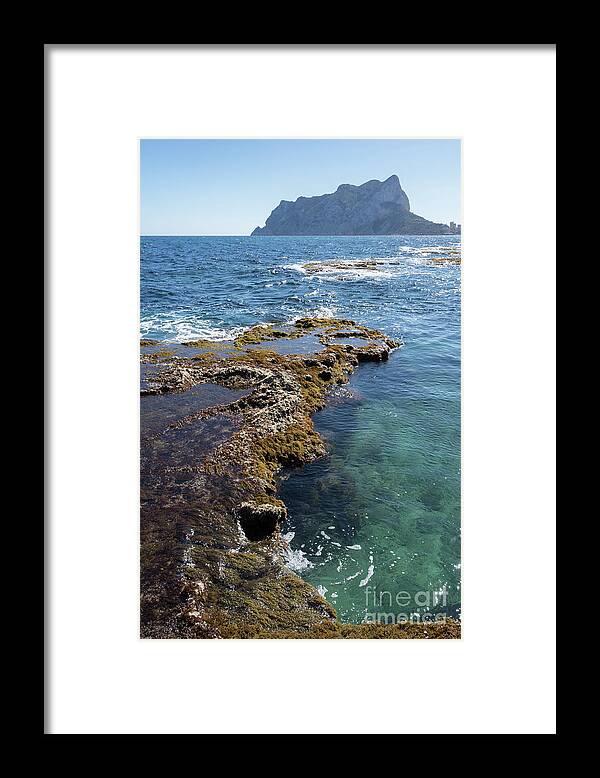 Mediterranean Coast Framed Print featuring the photograph Clear water and the Penon de Ifach in Calpe by Adriana Mueller