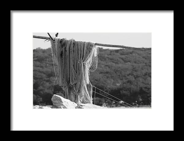 Tranquility Framed Print featuring the photograph Close-up of fishing net on wood by Marek Michalek / FOAP