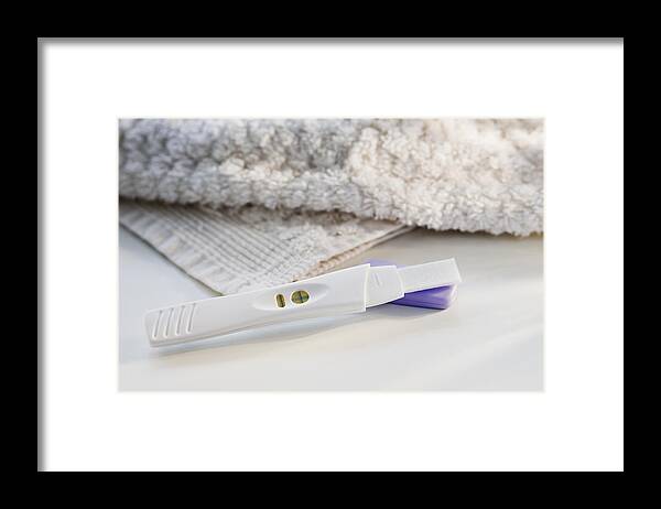 White Background Framed Print featuring the photograph Close up of pregnancy test by Tetra Images
