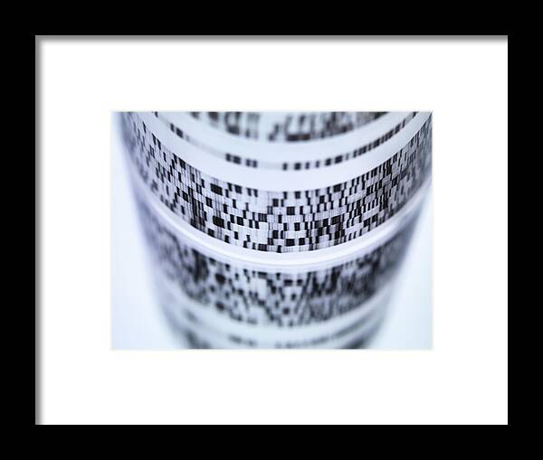 Curve Framed Print featuring the photograph Close up of rolled autoradiograph used in researching genetics by Andrew Brookes