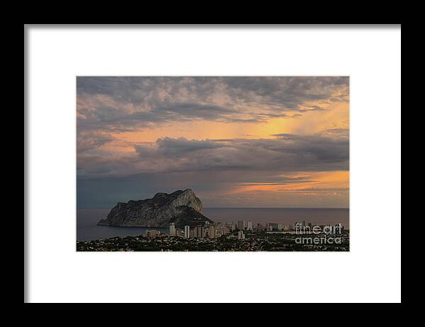 Sunset Framed Print featuring the photograph Clouds on the Mediterranean coast in Calpe by Adriana Mueller