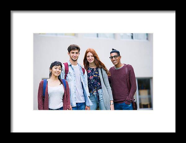 Young Men Framed Print featuring the photograph College students standing together outdoors, portrait by PhotoAlto/Frederic Cirou