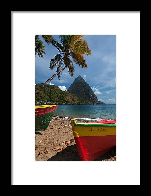 Tranquility Framed Print featuring the photograph Colorful boats on the beach in Soufrieire, St Lucia with the Pitons in the background.The famous Pitons of St Lucia are volcanic plugs rising out of the sea at the south end of the island. by Reed Kaestner
