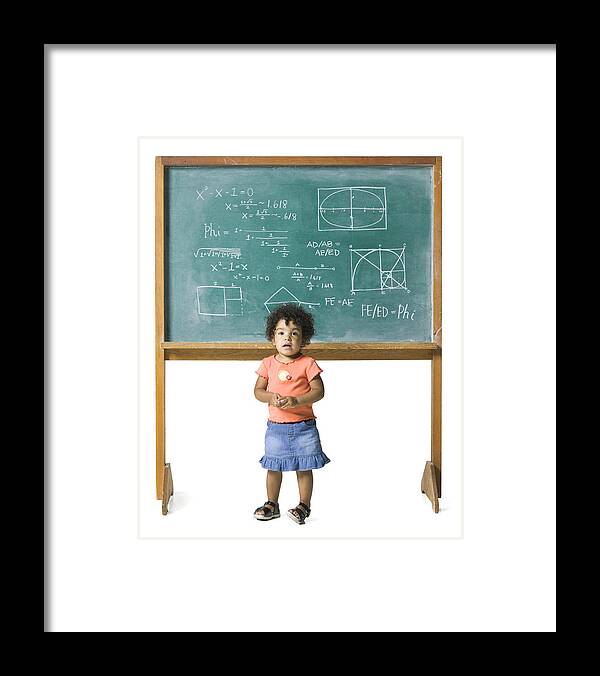 Expertise Framed Print featuring the photograph Conceptual Shot Of A Young Female Child In Front Of A Problem On A Chalkboard by Photodisc