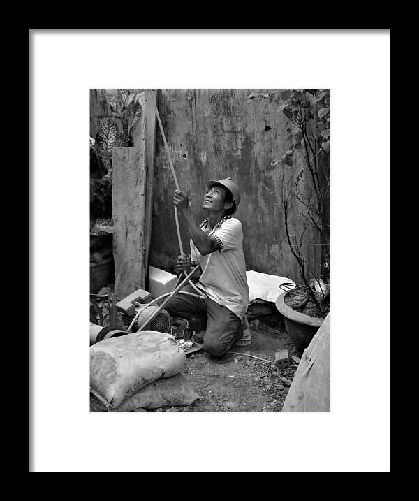 Construction Framed Print featuring the photograph Construction worker with the rope by Robert Bociaga
