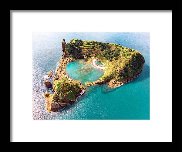 Triangle Shape Framed Print featuring the photograph Cool aerial view of circle pool inside volcanic island with eye shape in the Azores islands. by Artur Debat