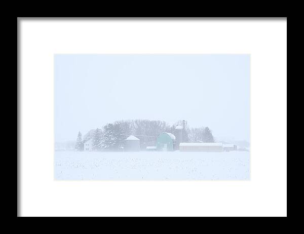 Pastel Framed Print featuring the photograph Cool Pastels - pastel colored farm buildings in a Wisconsin snowstorm by Peter Herman