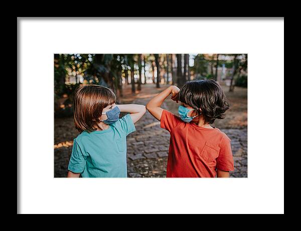 Protective Face Mask Framed Print featuring the photograph COVID-19 alternative handshakes by Andreswd