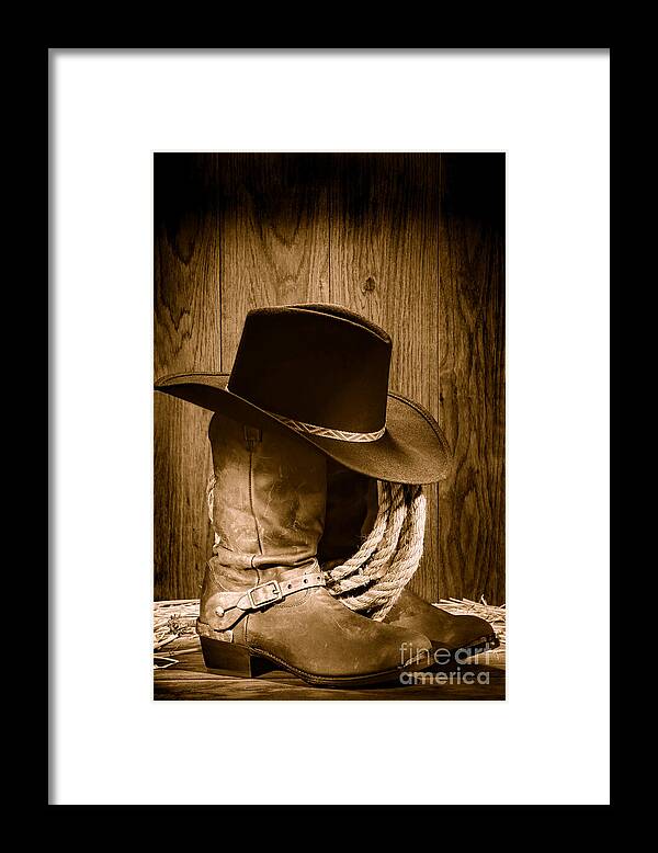 Antique Framed Print featuring the photograph Cowboy Hat on Boots - Sepia by Olivier Le Queinec