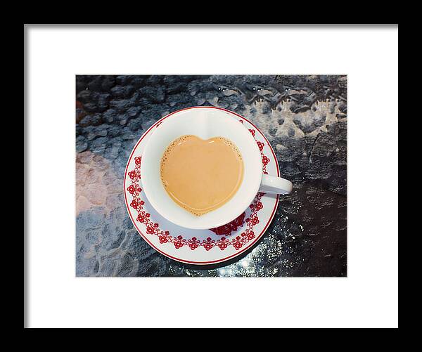 On Top Of The World Framed Print featuring the photograph Cup of tea in heart shape cup by Lyn Holly Coorg